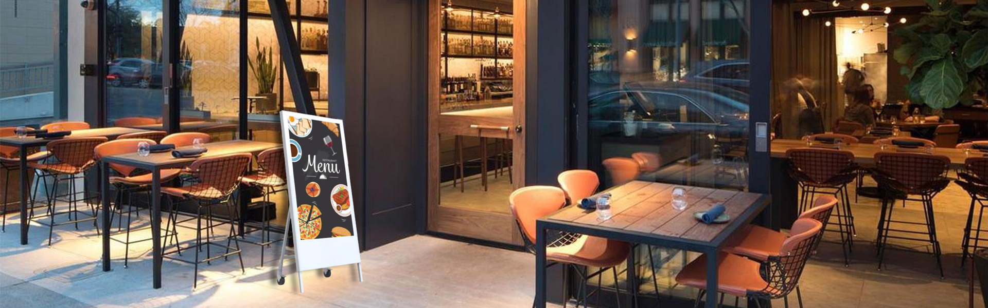 The picture shows portable digital display screens placed at the entrance of the restaurant.